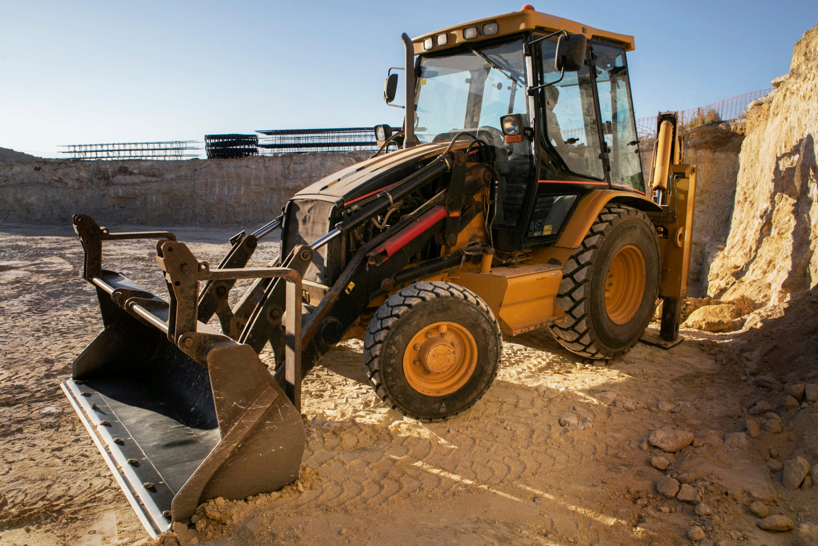 excavator digging ground day light